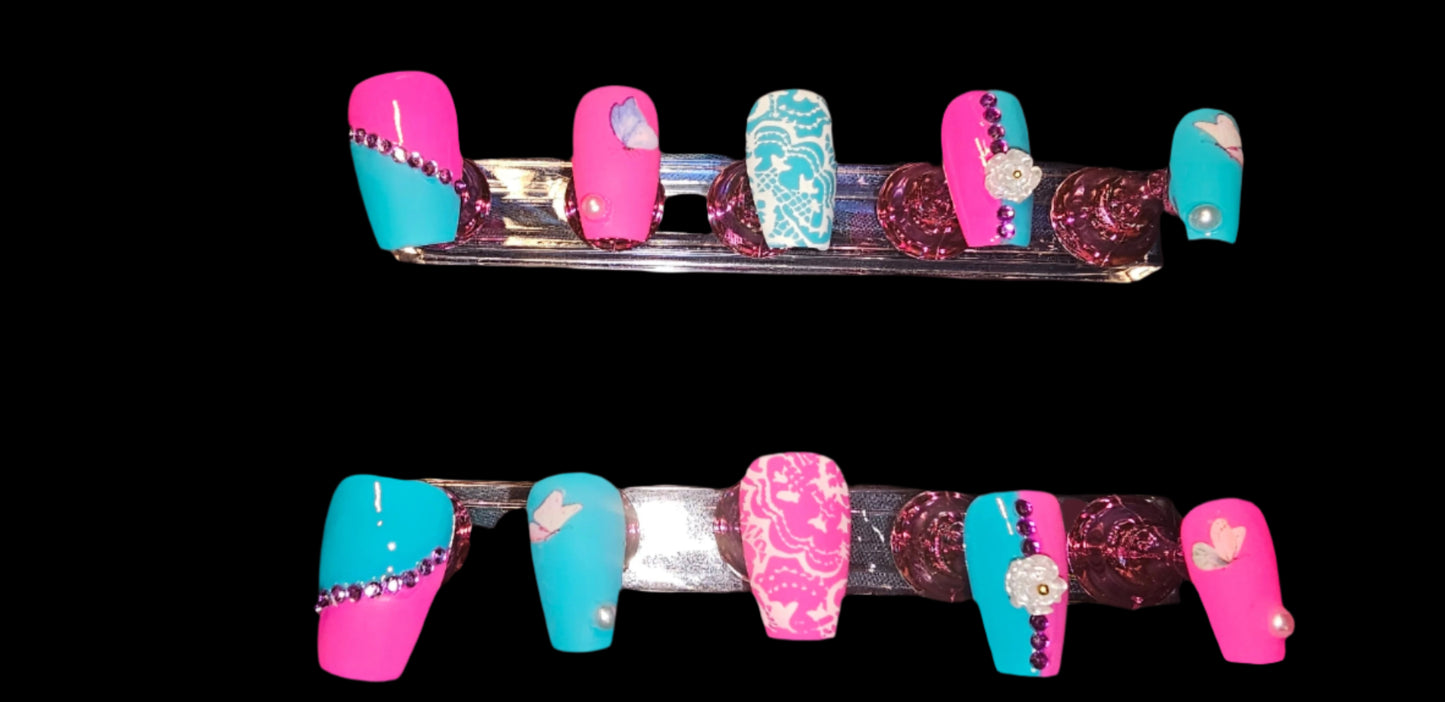 blue and pink colors, matt and gloss finish with gems, 3D flowers, 3D pearls and butterfly's